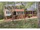 Charming two-story brick home with a landscaped front yard and mature trees, offering classic curb appeal at 2115 Hawthorne Pt, Marietta, GA 30062