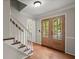 Welcoming foyer with hardwood floors and a view of the front yard, creating a warm and inviting entrance at 2115 Hawthorne Pt, Marietta, GA 30062