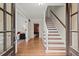 Bright foyer with hardwood floors and a staircase leading to the second floor, creating a welcoming entrance at 2115 Hawthorne Pt, Marietta, GA 30062