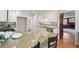 Open kitchen with granite island, stainless appliances, tile backsplash and hardwood floors at 2115 Hawthorne Pt, Marietta, GA 30062