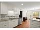 Spacious kitchen featuring granite countertops, tiled backsplash, stainless steel appliances, and hardwood floors at 2115 Hawthorne Pt, Marietta, GA 30062