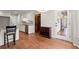 Bright kitchen with hardwood floors, granite countertops, wine rack and access to a light-filled entry at 2115 Hawthorne Pt, Marietta, GA 30062