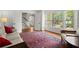 Bright living room with hardwood floors, a view of the front yard, and comfortable seating, perfect for relaxing at 2115 Hawthorne Pt, Marietta, GA 30062