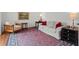 Comfortable living room with hardwood floors, a sofa, an arm chair and a beautiful rug, great for relaxation at 2115 Hawthorne Pt, Marietta, GA 30062