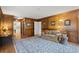 Living room with wood paneling, large area rug, and access to other rooms at 2115 Hawthorne Pt, Marietta, GA 30062