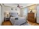 Bedroom featuring a large window and view, wooden floors and a ceiling fan at 300 Peachtree Ne St # 18I, Atlanta, GA 30308