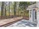 Outdoor deck with decorative lattice railing and surrounding mature trees at 534 Creekstone Dr, Jonesboro, GA 30236