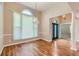 Elegant dining room featuring hardwood floors, a chandelier, high ceilings, and abundant natural light at 534 Creekstone Dr, Jonesboro, GA 30236