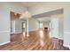 Open-concept living room with hardwood floors, a chandelier, and ample space for entertaining guests at 534 Creekstone Dr, Jonesboro, GA 30236
