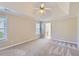 Spacious main bedroom with vaulted ceilings, carpet and ensuite bath at 534 Creekstone Dr, Jonesboro, GA 30236