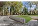 Grassy backyard with concrete retaining wall and mature trees at 175 Holly Nw Rd, Atlanta, GA 30314