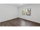 Bright bedroom featuring dark laminate flooring and windows providing natural light at 175 Holly Nw Rd, Atlanta, GA 30314