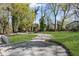Spacious driveway and front yard provide ample parking and a beautiful approach to the property at 175 Holly Nw Rd, Atlanta, GA 30314