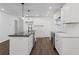 Well-equipped kitchen featuring modern appliances, bright white cabinets, and stylish finishes at 175 Holly Nw Rd, Atlanta, GA 30314