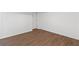 Neutral room showcasing wood-look flooring, white walls, and crisp white trim at 175 Holly Nw Rd, Atlanta, GA 30314