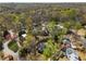 Aerial view showcasing a home in a beautiful neighborhood with mature trees and well-manicured lawns at 570 Glen Eagles Se Cir, Marietta, GA 30067