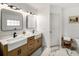 Stylish bathroom featuring dual sinks with modern fixtures, marble tile flooring, and ample counter space at 570 Glen Eagles Se Cir, Marietta, GA 30067
