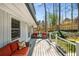 View of the outdoor deck featuring a seating area, gray decking, and white railings at 570 Glen Eagles Se Cir, Marietta, GA 30067