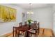 Formal dining room with hardwood floors, traditional furnishings, and natural light at 570 Glen Eagles Se Cir, Marietta, GA 30067