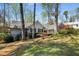Charming home featuring manicured landscaping and mature trees, nestled on a lush, green lot at 570 Glen Eagles Se Cir, Marietta, GA 30067