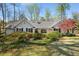 Charming home with manicured lawn, lush landscaping, and inviting curb appeal at 570 Glen Eagles Se Cir, Marietta, GA 30067
