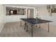 Spacious game room with a ping pong table and built-in bar area, offering entertainment and relaxation at 570 Glen Eagles Se Cir, Marietta, GA 30067