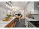 Open concept kitchen and dining area features island, stainless appliances and generous lighting at 570 Glen Eagles Se Cir, Marietta, GA 30067