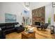 Spacious living room with a stone fireplace, wood floors, and comfortable seating at 570 Glen Eagles Se Cir, Marietta, GA 30067