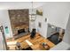 Cozy living room with a stone fireplace, wood floors, and a comfortable chair at 570 Glen Eagles Se Cir, Marietta, GA 30067