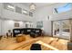 Spacious living room with hardwood floors, large windows, and a comfortable leather sofa at 570 Glen Eagles Se Cir, Marietta, GA 30067