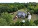 Aerial view of property featuring a home with large lot, mature trees, and trampoline at 12551 Alcovy Rd, Covington, GA 30014