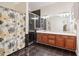 Bathroom features a double sink vanity, a glass enclosed shower, and tile floors at 12551 Alcovy Rd, Covington, GA 30014