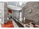 Beautiful dining room with stone accent wall, fireplace, and hardwood floors at 12551 Alcovy Rd, Covington, GA 30014