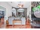 A welcoming living room featuring hardwood floors, stone arches, and an open floor plan at 12551 Alcovy Rd, Covington, GA 30014