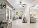 Relaxing sun room features French doors, neutral paint, and plenty of space at 12551 Alcovy Rd, Covington, GA 30014
