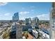 Stunning aerial view showcasing the city skyline and the surrounding urban landscape on a sunny day at 3324 Peachtree Ne Rd # 2808, Atlanta, GA 30326