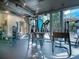 Fitness center equipped with machines, weights, and natural light from large windows at 3324 Peachtree Ne Rd # 2808, Atlanta, GA 30326