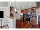 Compact kitchen featuring modern appliances, dark countertops, and bar seating for casual dining at 3324 Peachtree Ne Rd # 2808, Atlanta, GA 30326