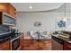 Modern kitchen features stainless steel appliances, granite countertops, and dark wood cabinetry at 3324 Peachtree Ne Rd # 2808, Atlanta, GA 30326