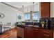 Stylish kitchen with modern appliances, black countertops, and easy access to the living room and dining area at 3324 Peachtree Ne Rd # 2808, Atlanta, GA 30326