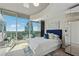 Bright bedroom featuring a walkout balcony with city views, large mirrored closets, and modern decor at 3324 Peachtree Ne Rd # 2808, Atlanta, GA 30326