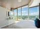 Bedroom with floor-to-ceiling windows offering stunning city views and a walk out balcony at 3324 Peachtree Ne Rd # 2808, Atlanta, GA 30326