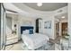 Spacious main bedroom with mirrored closets, a blue upholstered headboard, and ensuite bath at 3324 Peachtree Ne Rd # 2808, Atlanta, GA 30326