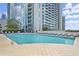 Outdoor swimming pool and lounge area with views of the city skyline at 3324 Peachtree Ne Rd # 2808, Atlanta, GA 30326
