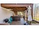 Inviting covered back deck features a hot tub, grill, and string lights for outdoor entertaining at 416 Delane Dr, Dallas, GA 30157