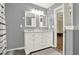 Large bathroom with double vanity, lots of lighting, and a shower and tub combo at 416 Delane Dr, Dallas, GA 30157