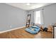 Cozy bedroom with hardwood floors, a large window, and plenty of space for imagination at 416 Delane Dr, Dallas, GA 30157