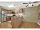 Eat-in kitchen featuring stainless steel appliances, tile backsplash, and wood cabinets at 416 Delane Dr, Dallas, GA 30157