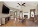 Spacious living room features vaulted ceiling, fireplace, and wood flooring at 416 Delane Dr, Dallas, GA 30157