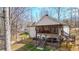 Two-story screened deck boasts outdoor seating and a hot tub overlooking the backyard at 416 Delane Dr, Dallas, GA 30157